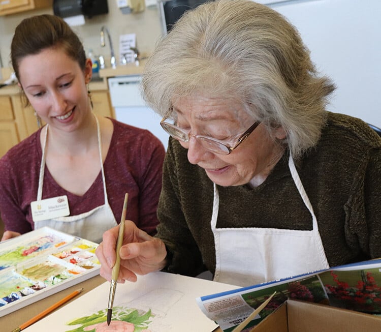 Two women painting