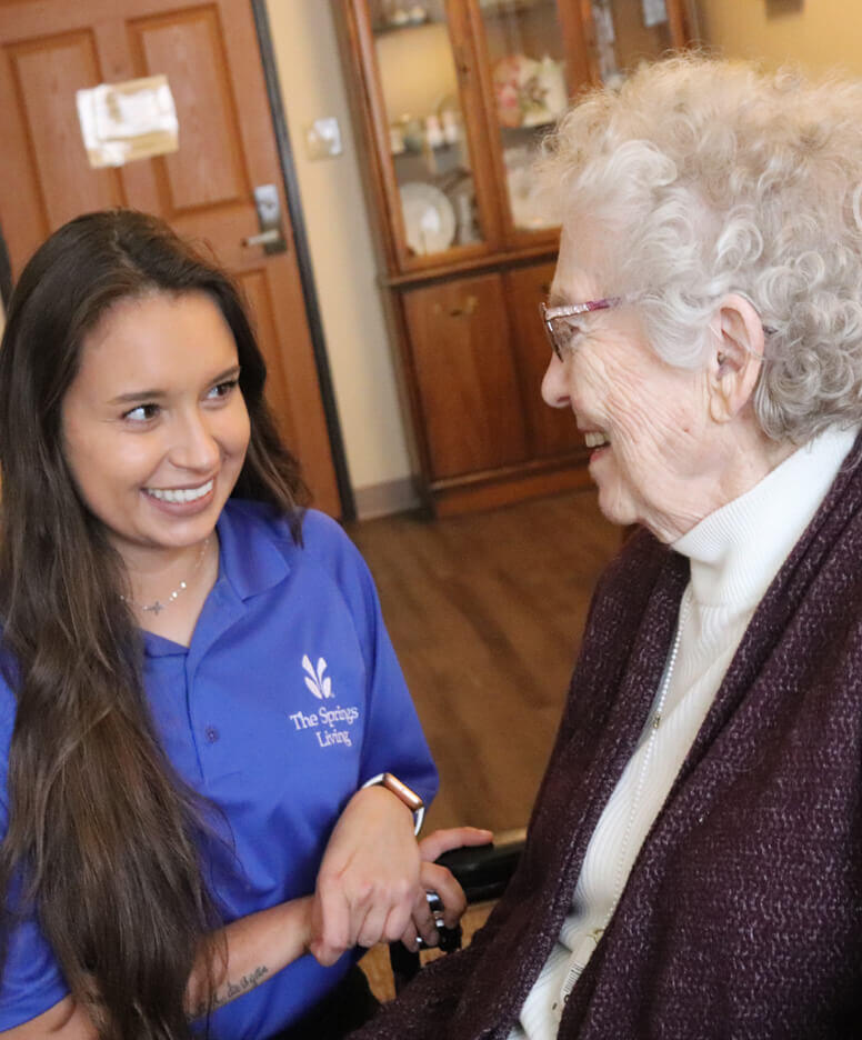 Caregiver with resident at The Springs Living community