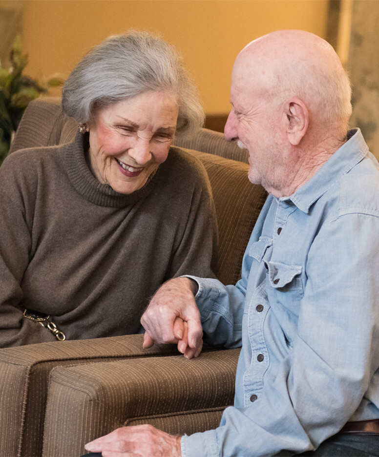 Older couple holding hands