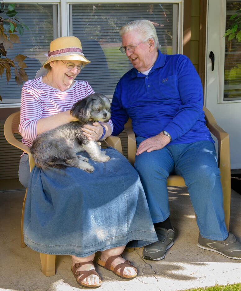 Couple with dog at the Sunnyview community