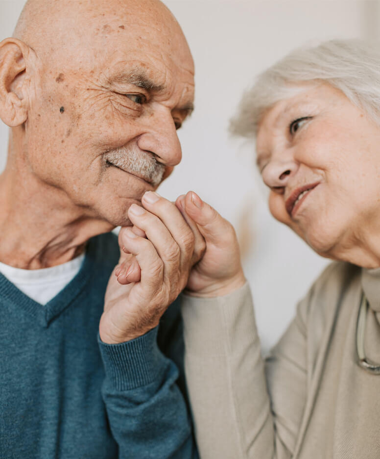 Resident couple holding hands at the Lancaster Village community
