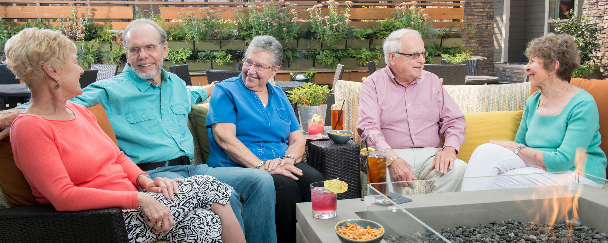 Residents sitting outside on a patio