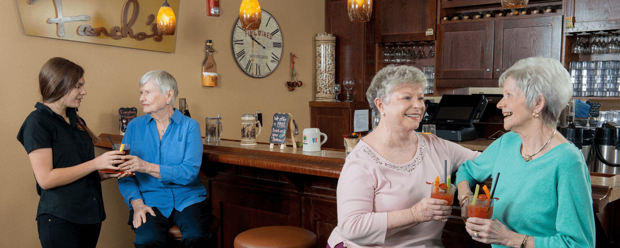 Residents enjoying drinks at the bar