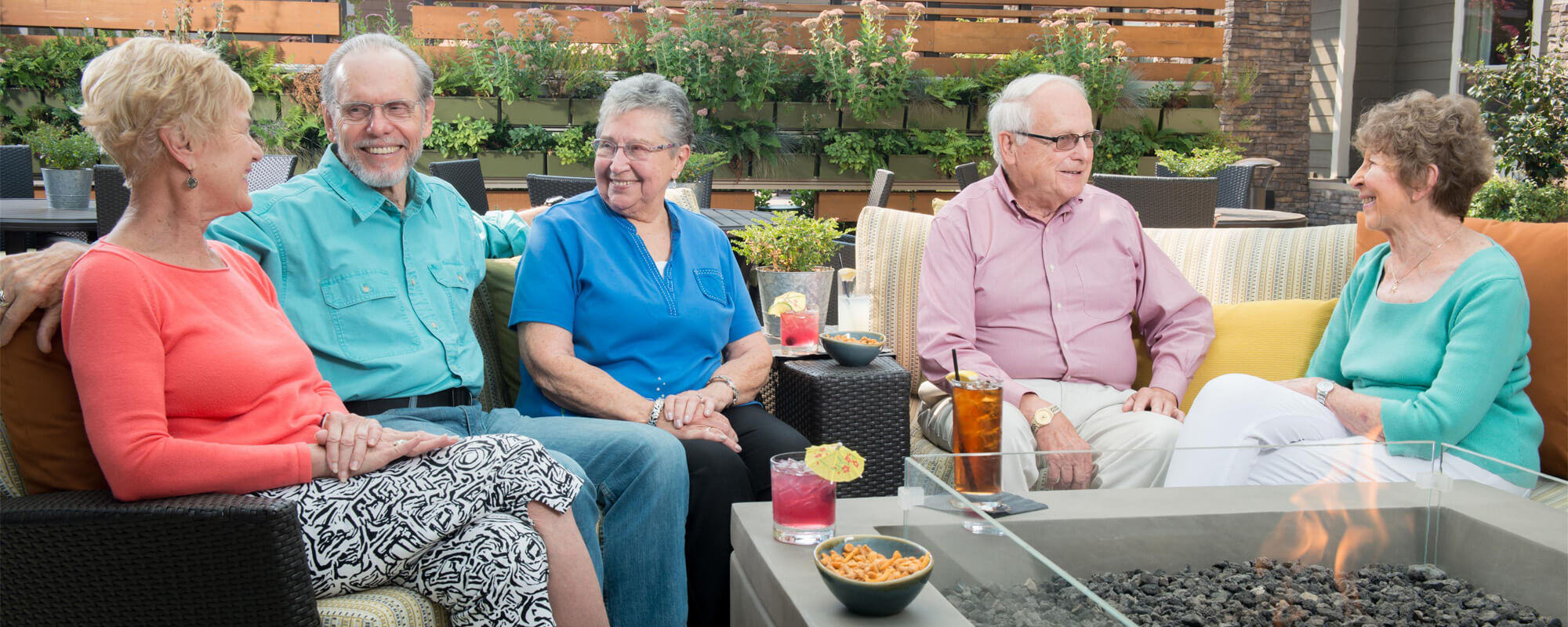 Residents sitting outside at the Greer Gardens community