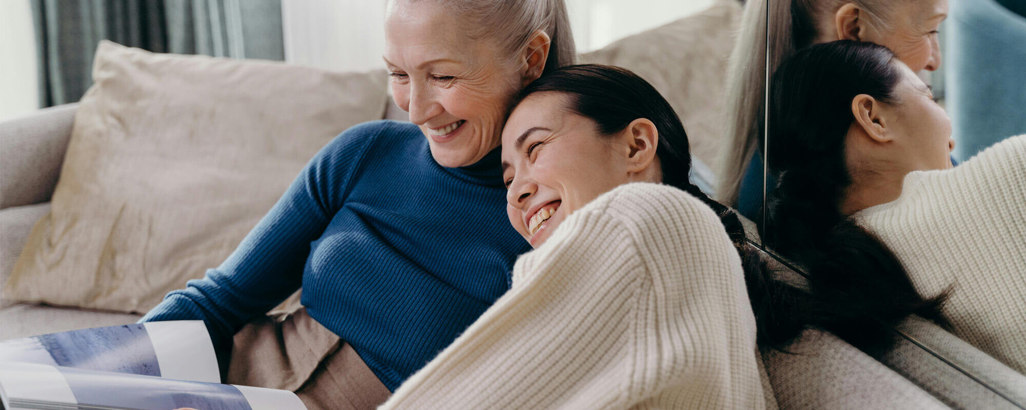 Mother and daughter looking at a book