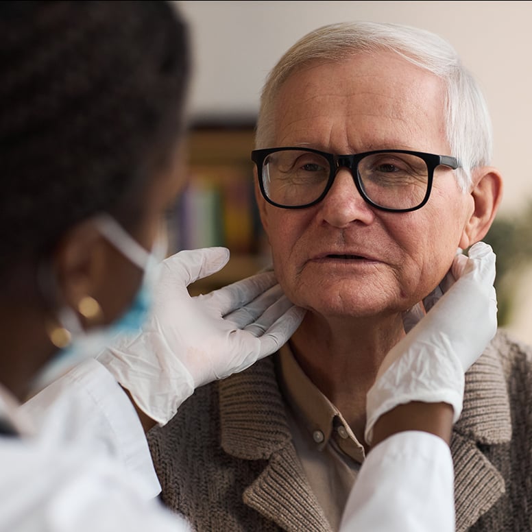 senior-man-examined-by-healthcare-worker-at-home-2026-03-10-04-01-42-utc_web