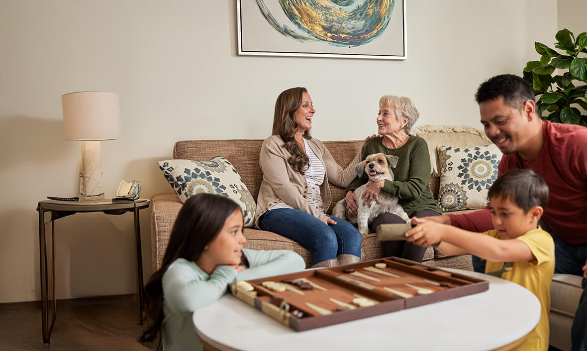 Family hanging out together playing backgammon