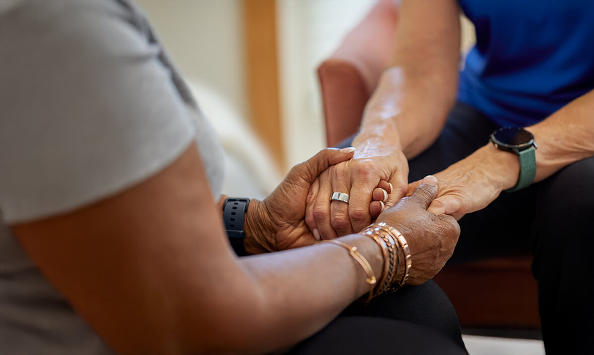 Two people holding hands