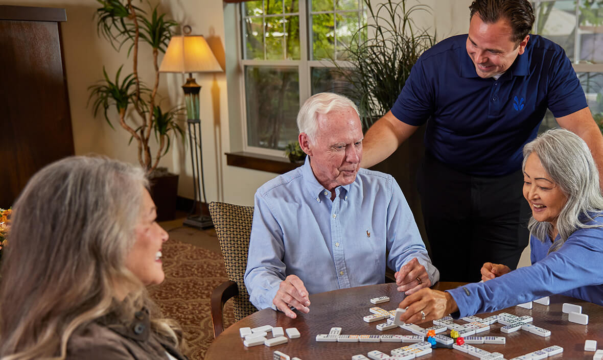 Group of people playing dominos together