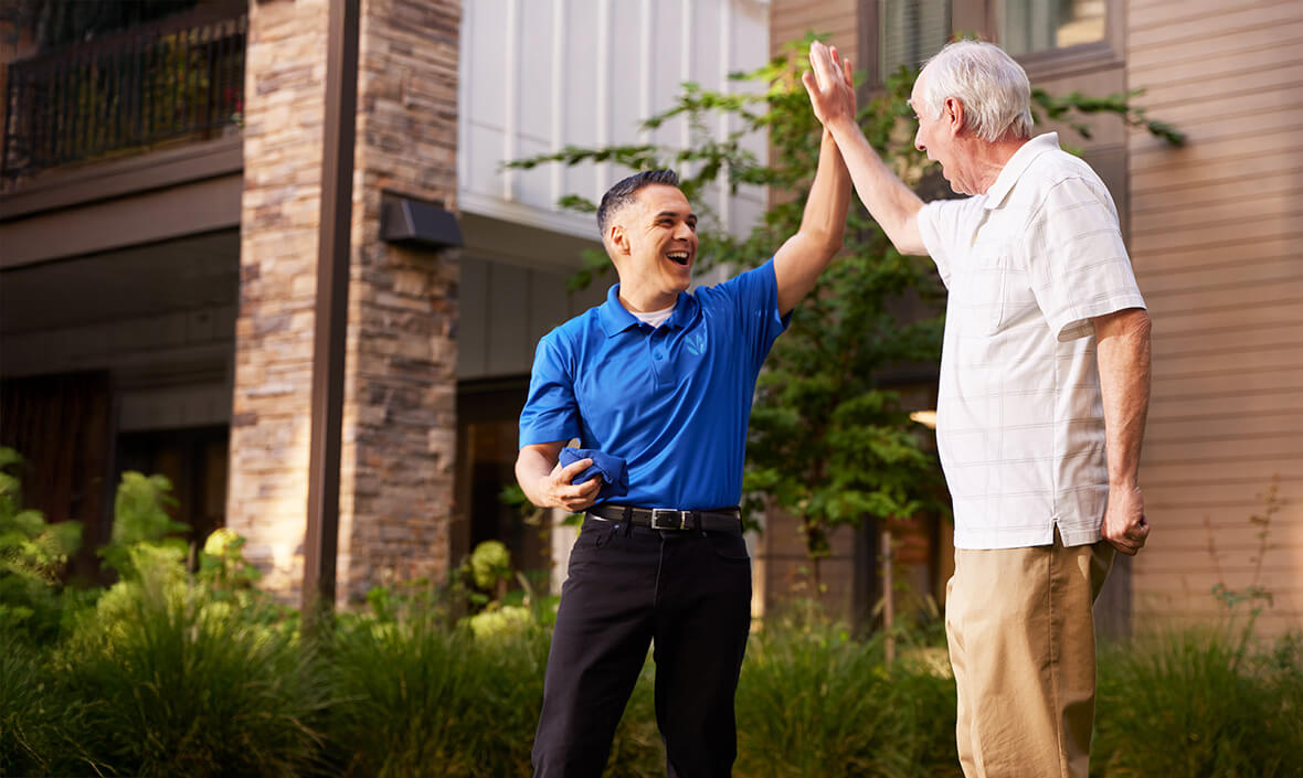 Two men high-fiving