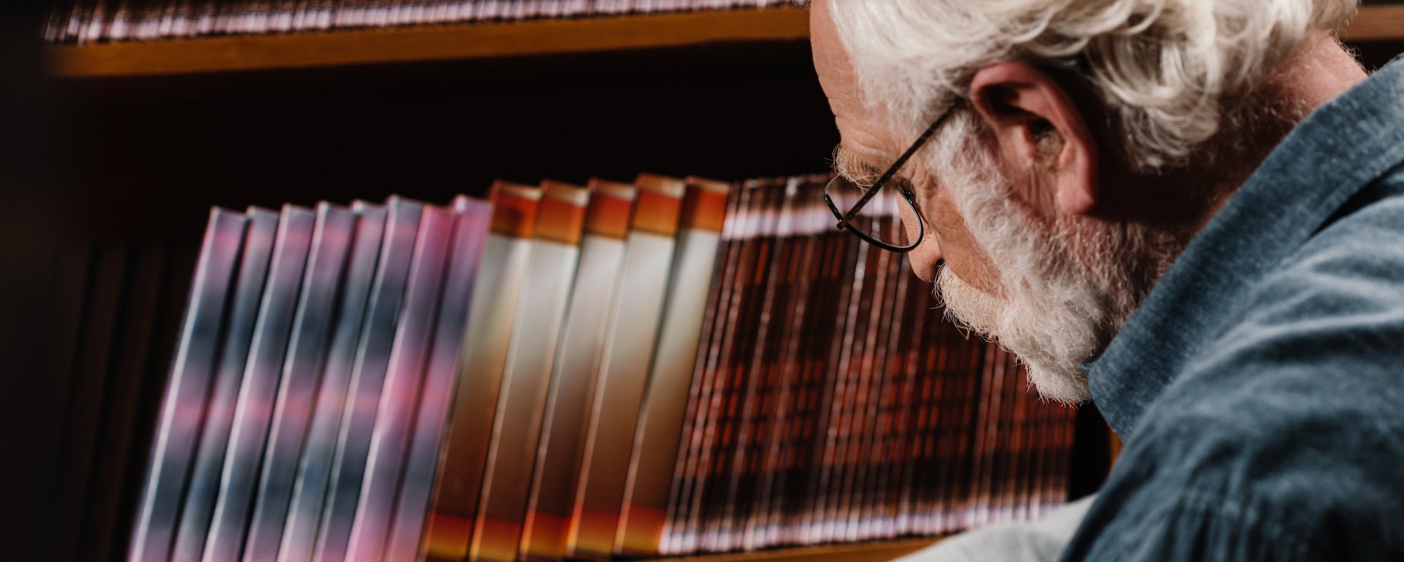 grey-hair-librarian-searching-for-book-2024-11-18-20-06-59-utc-1