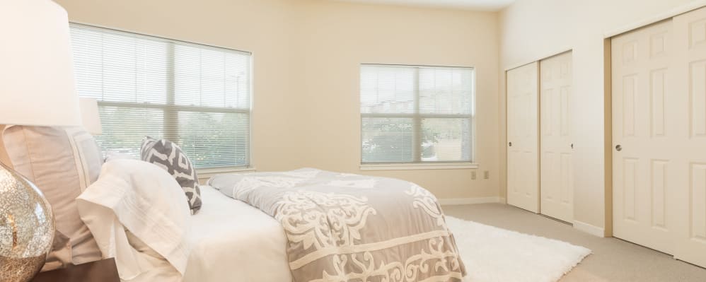 Large bedroom with windows in senior living apartment at The Springs at Tanasbourne in Hillsboro, Oregon