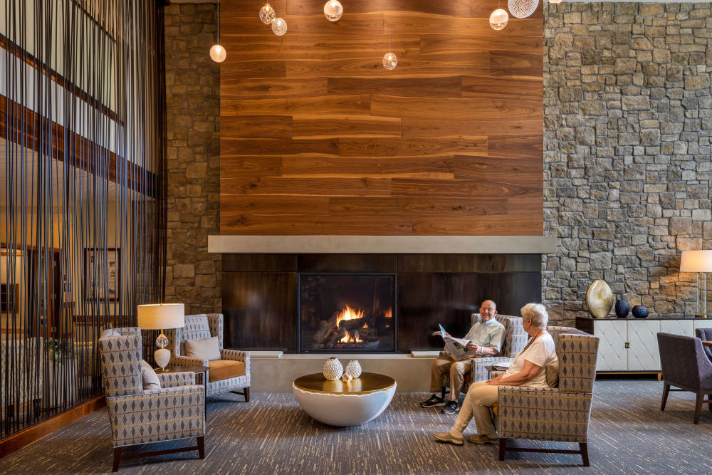 Upscale reception area with plenty of seating and a fireplace at The Springs at Lake Oswego in Lake Oswego, Oregon