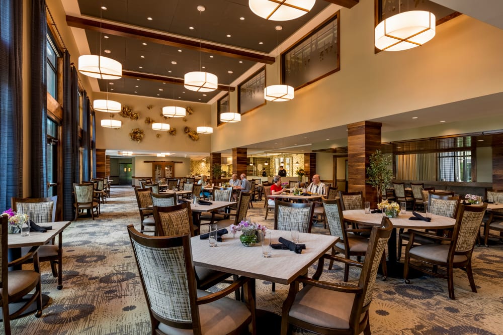 Dining hall with a 3-story ceiling at The Springs at Lake Oswego in Lake Oswego, Oregon