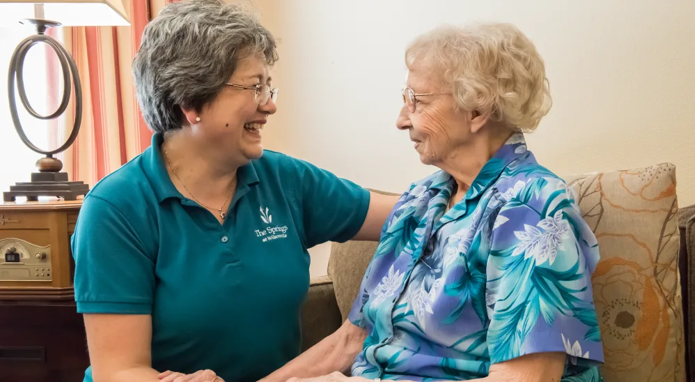 Resident with caregiver at The Springs at Wilsonville in Wilsonville, Oregon
