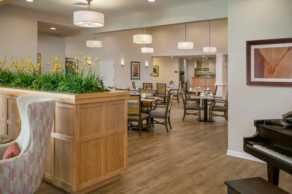 Lounge are with card times, comfortable seating and a piano at The Springs at Clackamas Woods in Milwaukie, Oregon