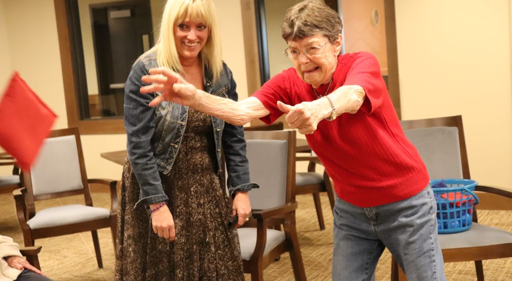 Resident and careviver playing a game at The Springs at Bozeman in Bozeman, Montana