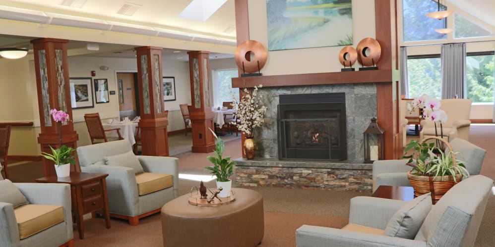 Comfortable lounge area with fire place at The Springs at Carman Oaks in Lake Oswego, Oregon