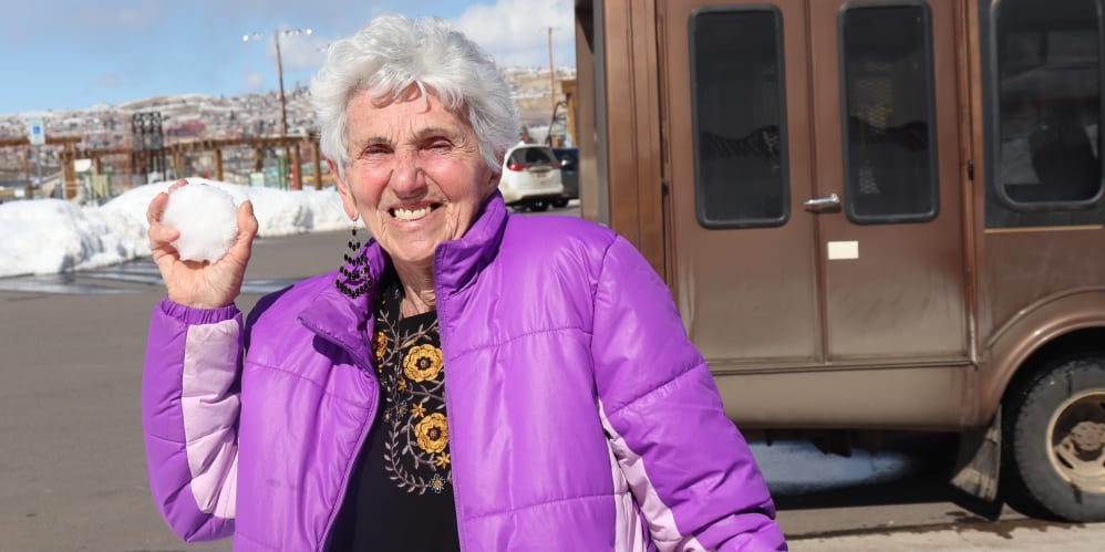 Resident enjoying winter fun at The Springs at Butte in Butte, Montana