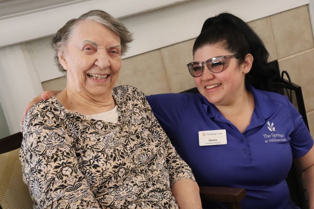 Smiling resident and caregiver at The Springs at Willowcreek in Salem, Oregon