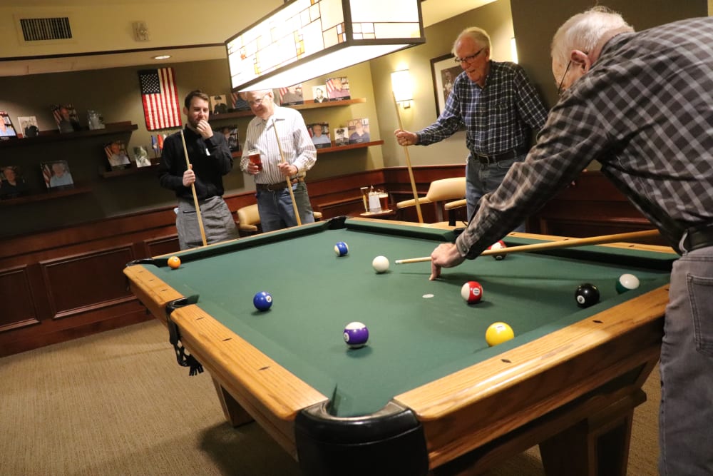 Residents playing pool at The Springs at Carman Oaks in Lake Oswego, Oregon
