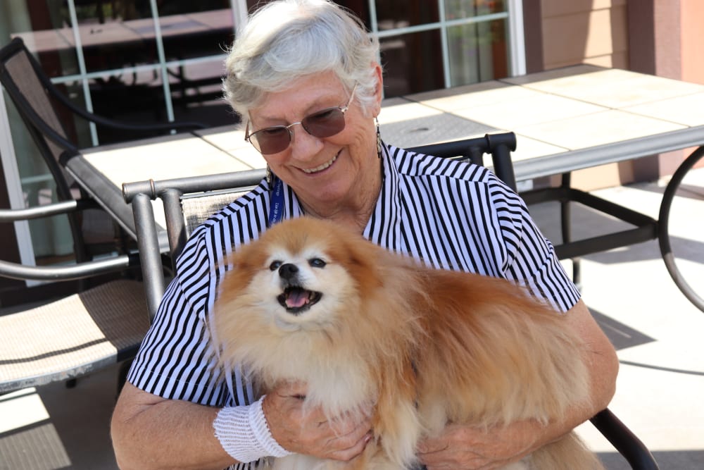 Resident with their cute dog at The Springs at Missoula in Missoula, Montana.