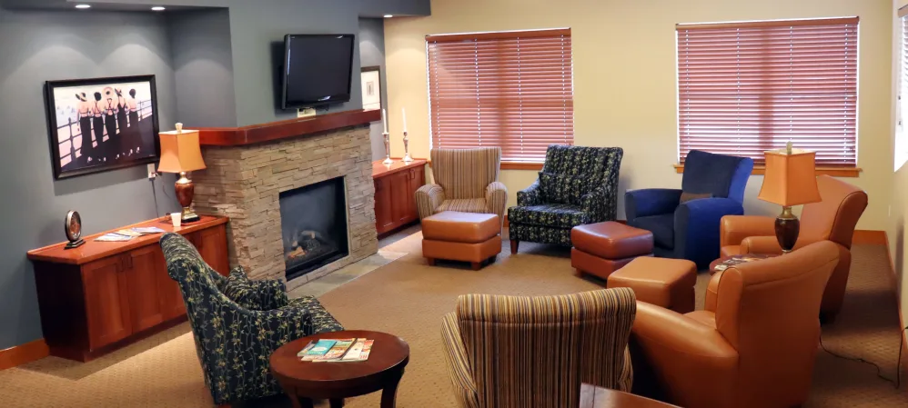 Elegant communal lounge area with comfortable leather chairs at The Springs at Mill Creek in The Dalles, Oregon