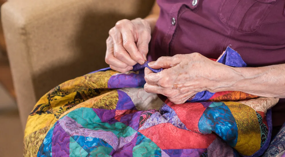 Resident quilting at The Springs at Tanasbourne in Hillsboro, Oregon 