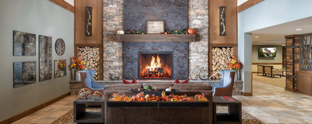 Beautiful communal fireplace in lounge area at The Springs at Bozeman in Bozeman, Montana