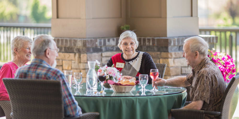 Residents enjoying dinner on patio at Medford, Oregon