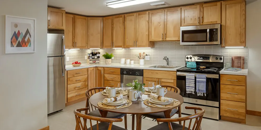 Well lit kitchen with wood accents at The Springs at Sherwood in Sherwood, Oregon