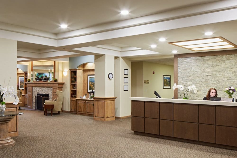Warm and inviting reception desk at The Springs at Anna Maria in Medford, Oregon