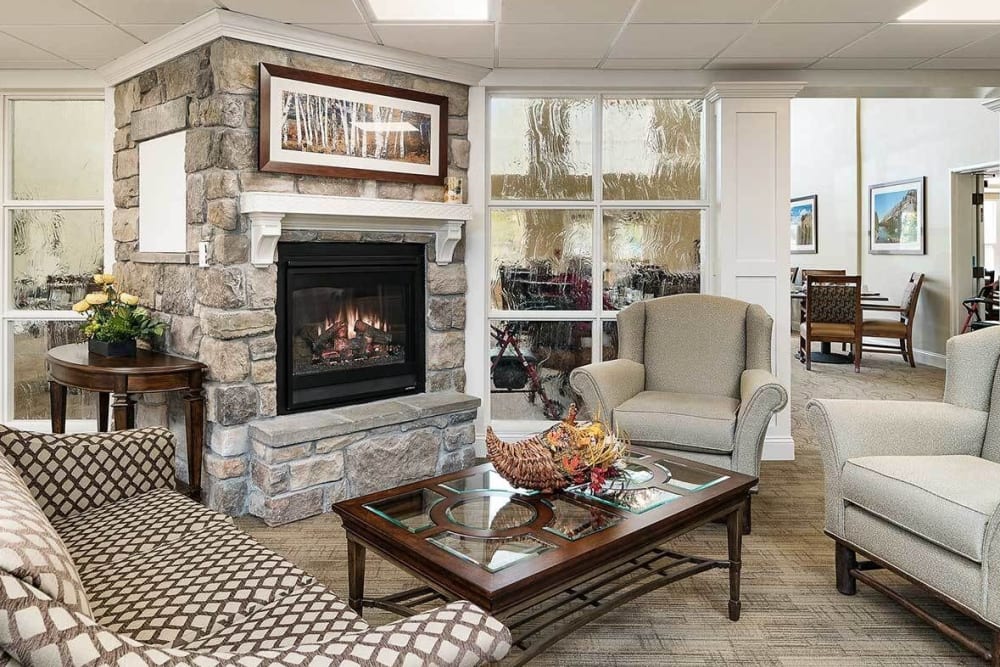 Lobby seating in upscale senior living facility with iniviting fireplace at The Springs at Grand Park in Billings, Montana