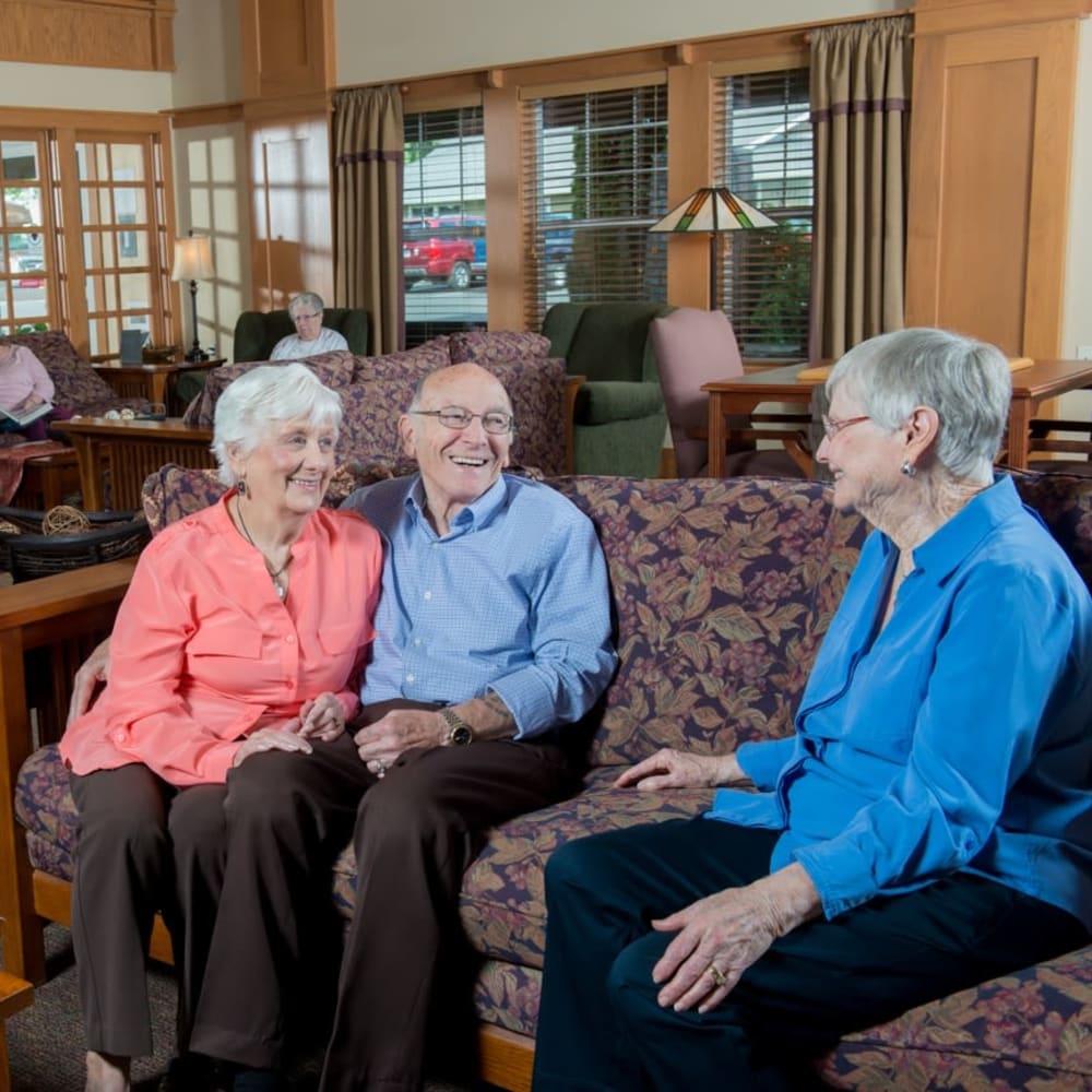 Residents laughing and talking at The Springs at Clackamas Woods in Milwaukie, Oregon
