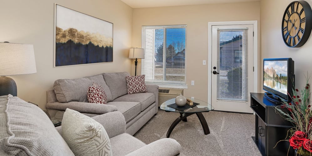 Upscale living room in apartment at The Springs at Grand Park in Billings, Montana