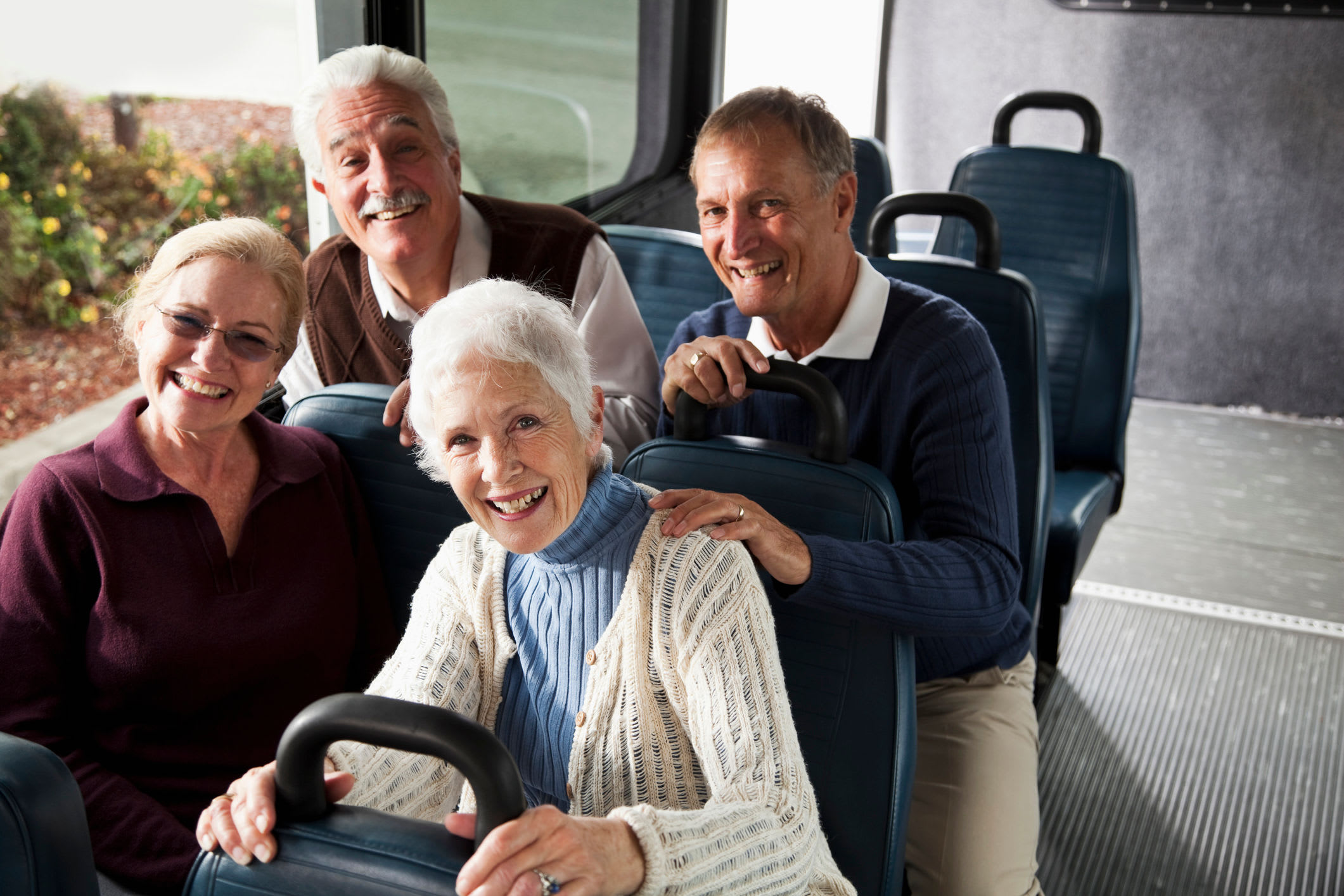 Residents smiling on the group transportation bus at The Springs at Sunnyview in Salem, Oregon